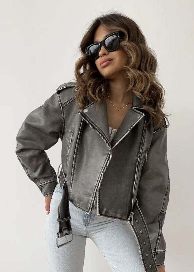 Women's black washed faux leather biker jacket with structured silhouette and vintage distressing