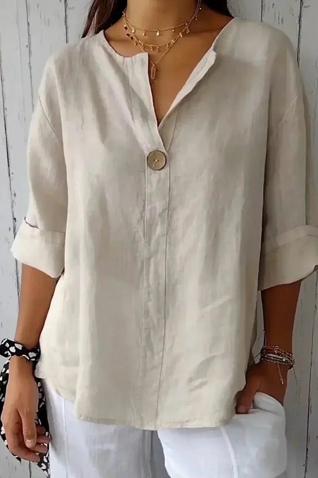 Women's relaxed blouse soft draped silhouette rolled short sleeves V-slit neckline button detail