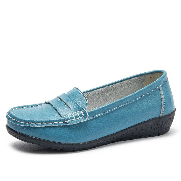 Women's black leather slip-on loafers with cushioned PU lining and flexible rubber sole for all-day comfort