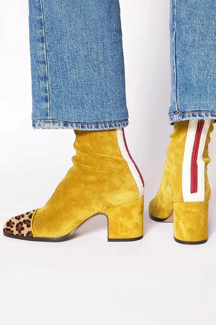 Women's mixed-texture block heel ankle boots with smooth and patterned panels, rounded toe