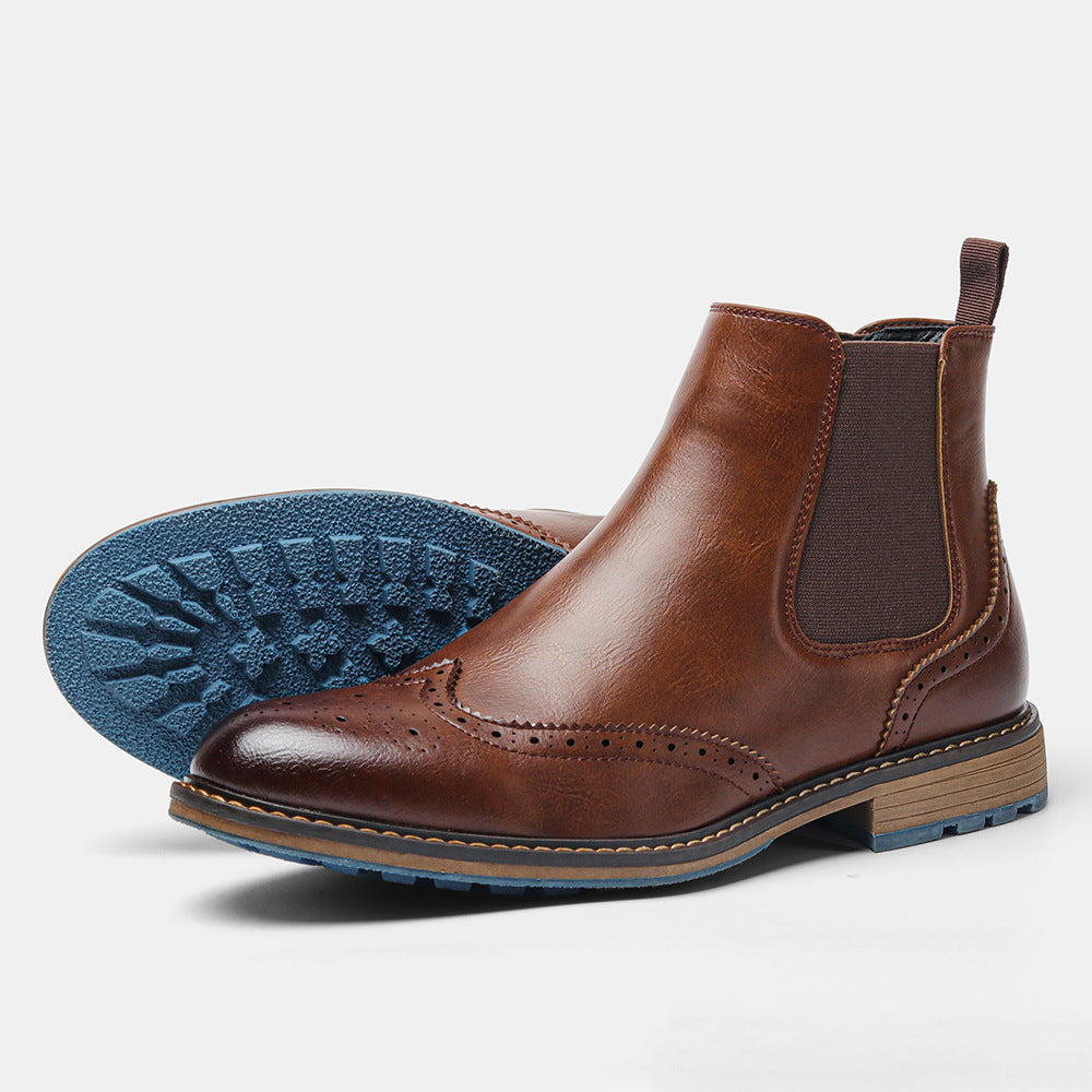 Men's brown leather Chelsea boots with elastic sides and classic brogue perforation details