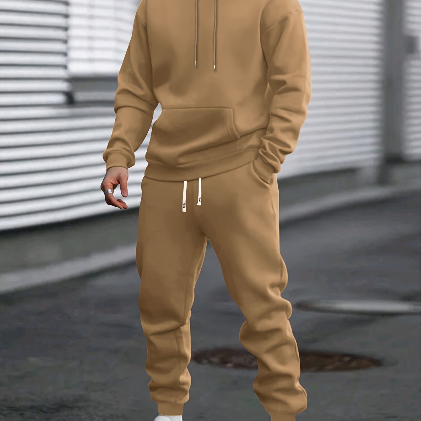 Men's gray pullover hoodie and jogger tracksuit set with drawstring hood for easy casual fit
