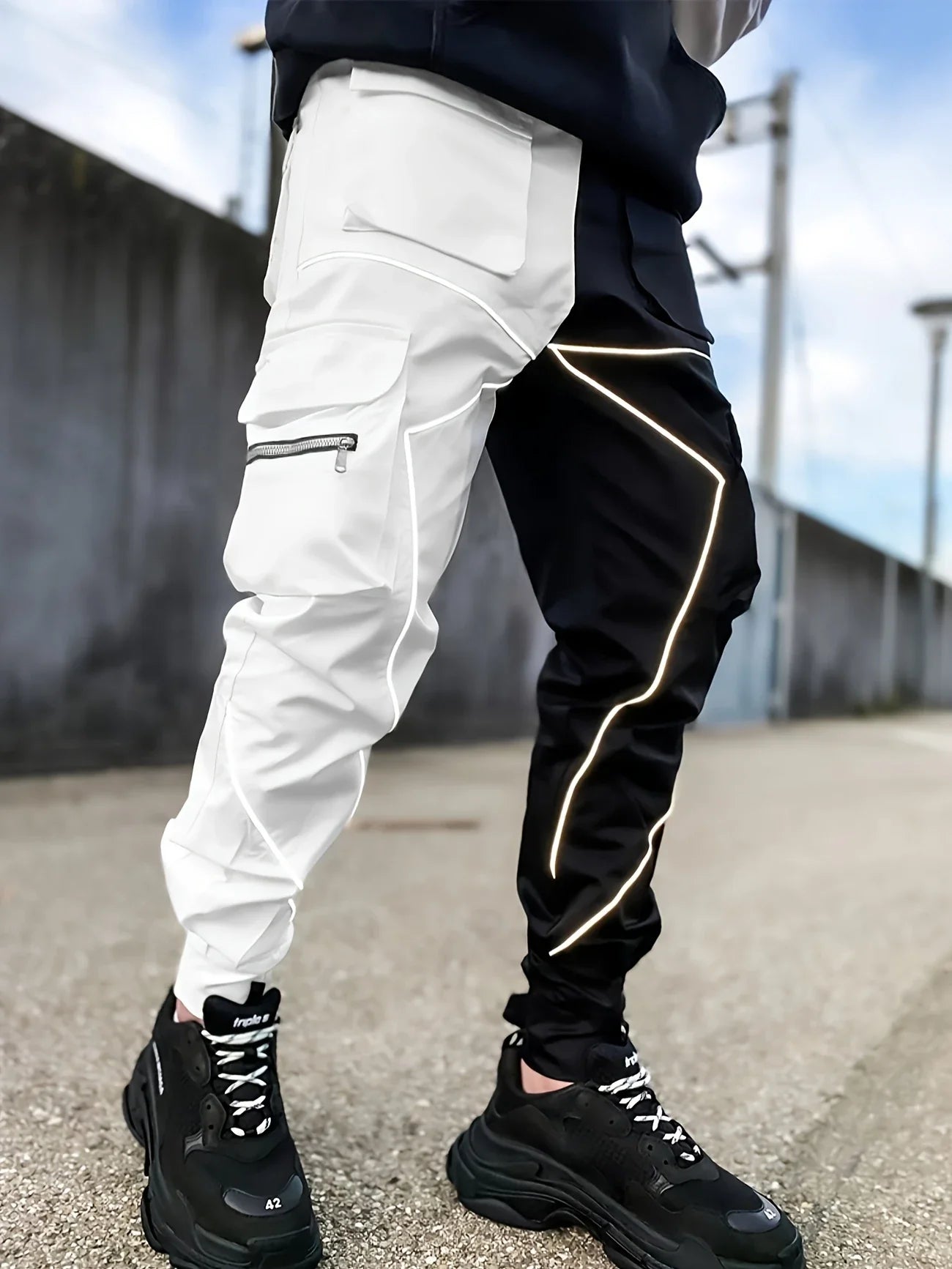 Black tapered cargo jogger with reflective high-visibility piping and featherweight performance fabric