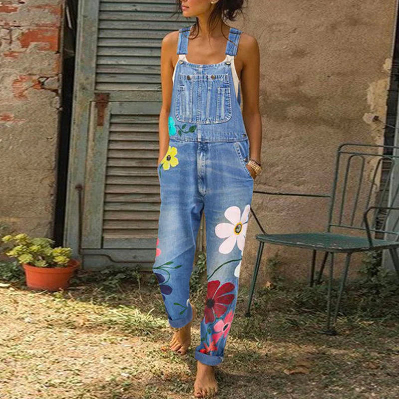 Women's blue denim floral print jumpsuit with flattering relaxed fit and feminine silhouette