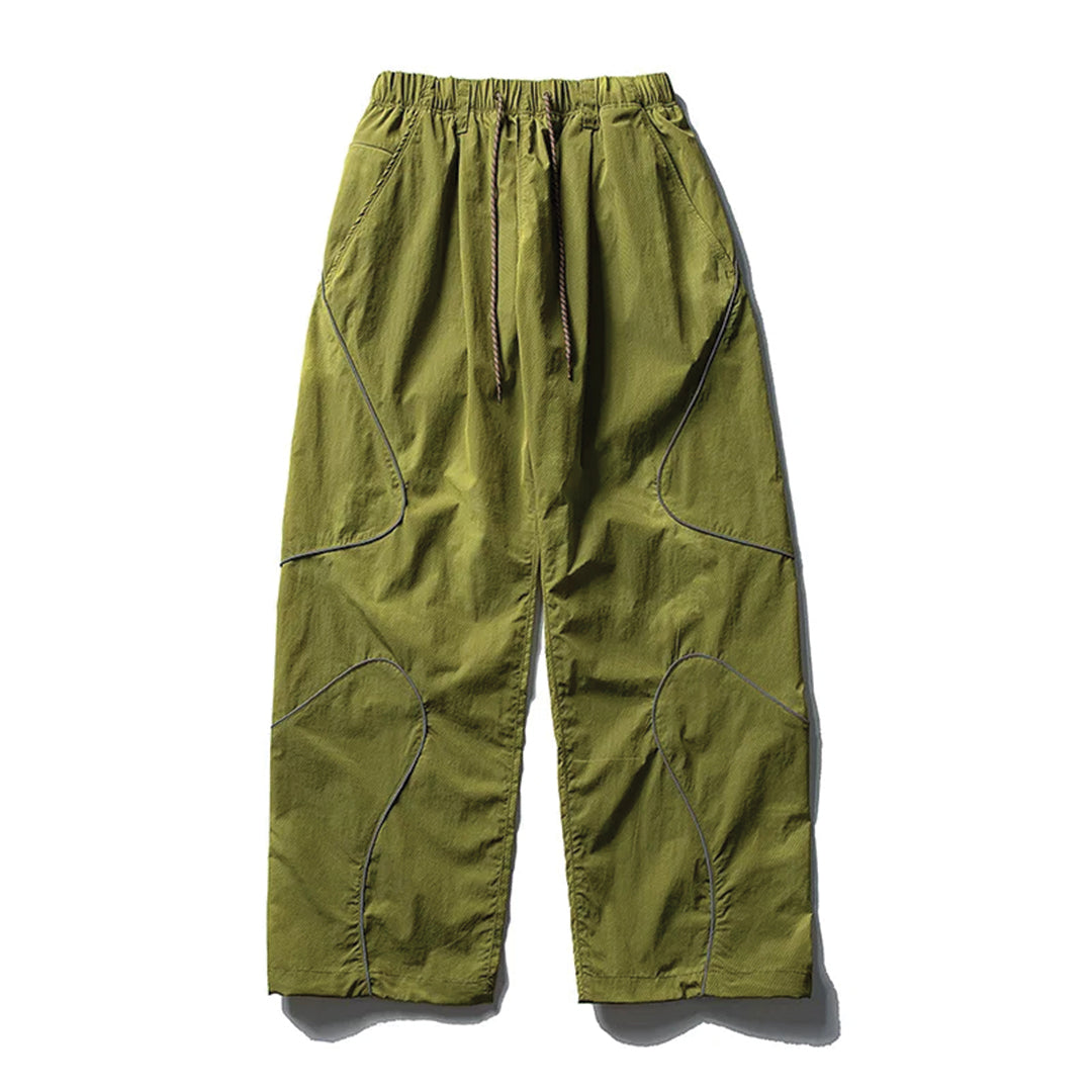 Black quick-dry nylon running trousers with curved reflective stripes and drawstring waist
