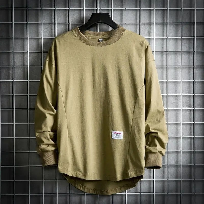 Oversized cream cotton crewneck pullover with drop hem, relaxed silhouette for effortless layering