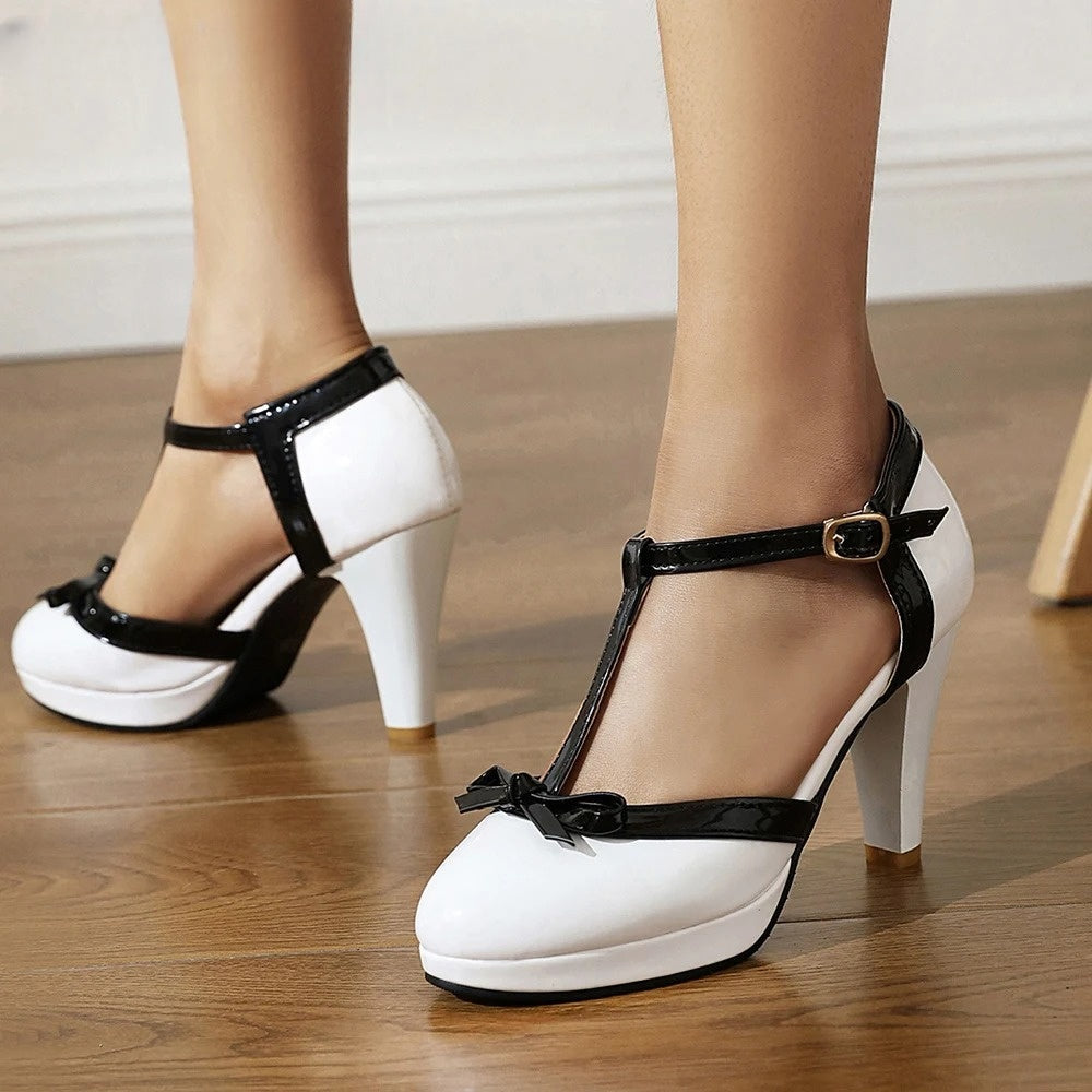 Madeleine nude T-strap block heels with bow accent, rounded toe, premium faux leather adjustable buckle