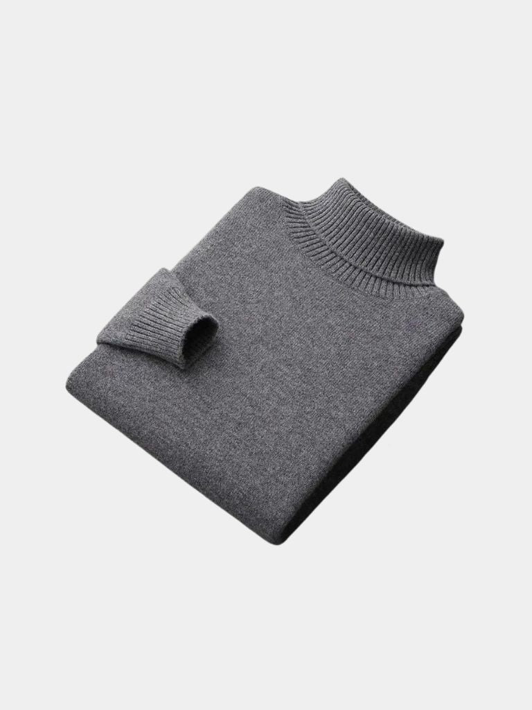 Ivory ribbed turtleneck sweater with snug high collar, soft knit texture, and refined office-ready silhouette