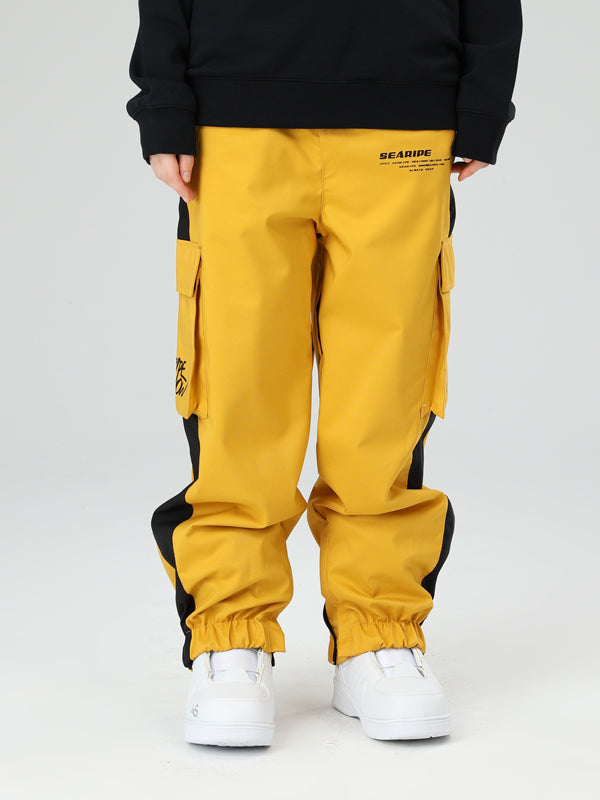 Women's oversized cargo snow pants in neutral tones, waterproof breathable freestyle cut with integrated gaiters