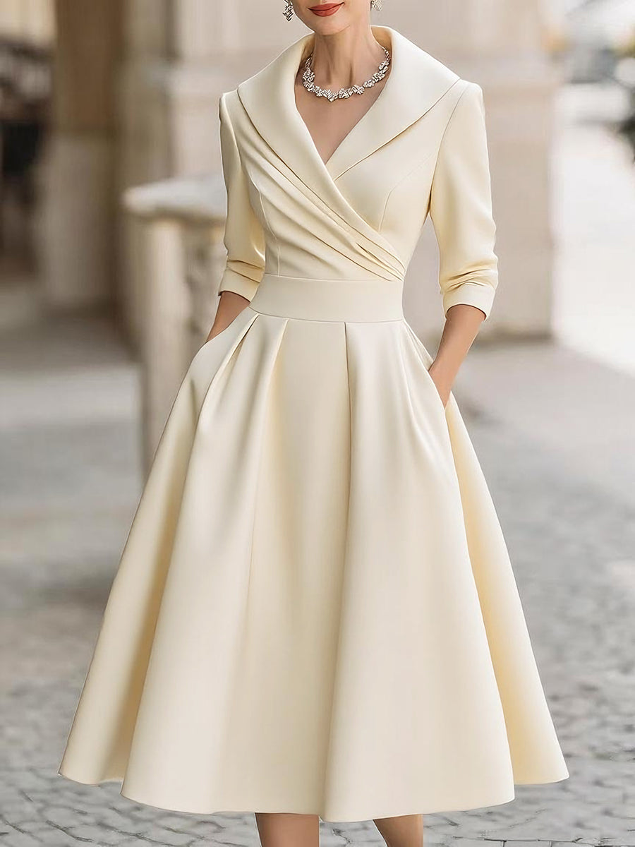 Black women's evening midi dress with wrap collar and flared skirt, elegant fitted silhouette