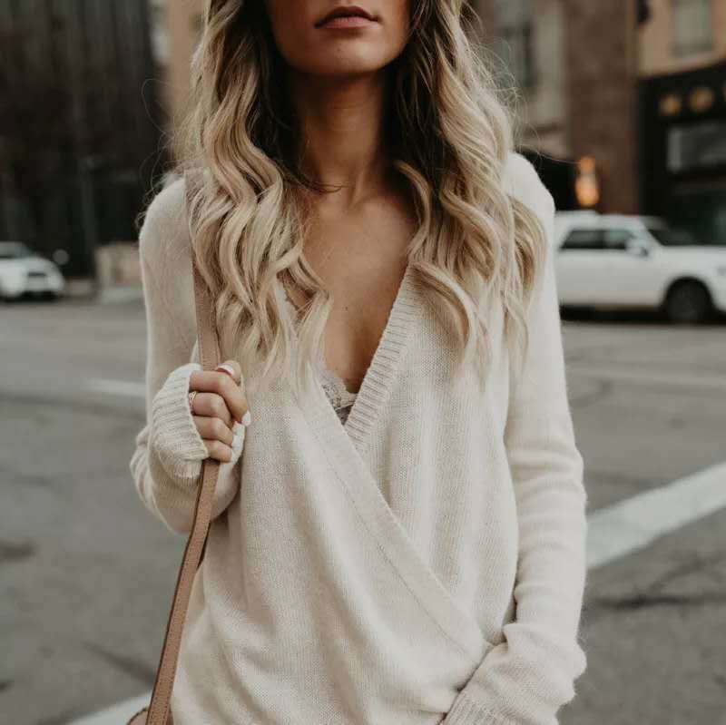 Women's wrap sweater knit texture deep V-neck relaxed fit neutral tones effortless layering style