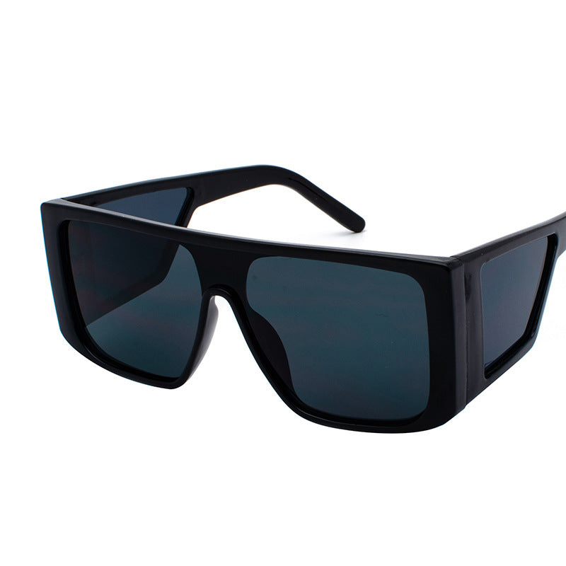Oversized angular retro sunglasses with colored UV400 lenses, bold futuristic festival style