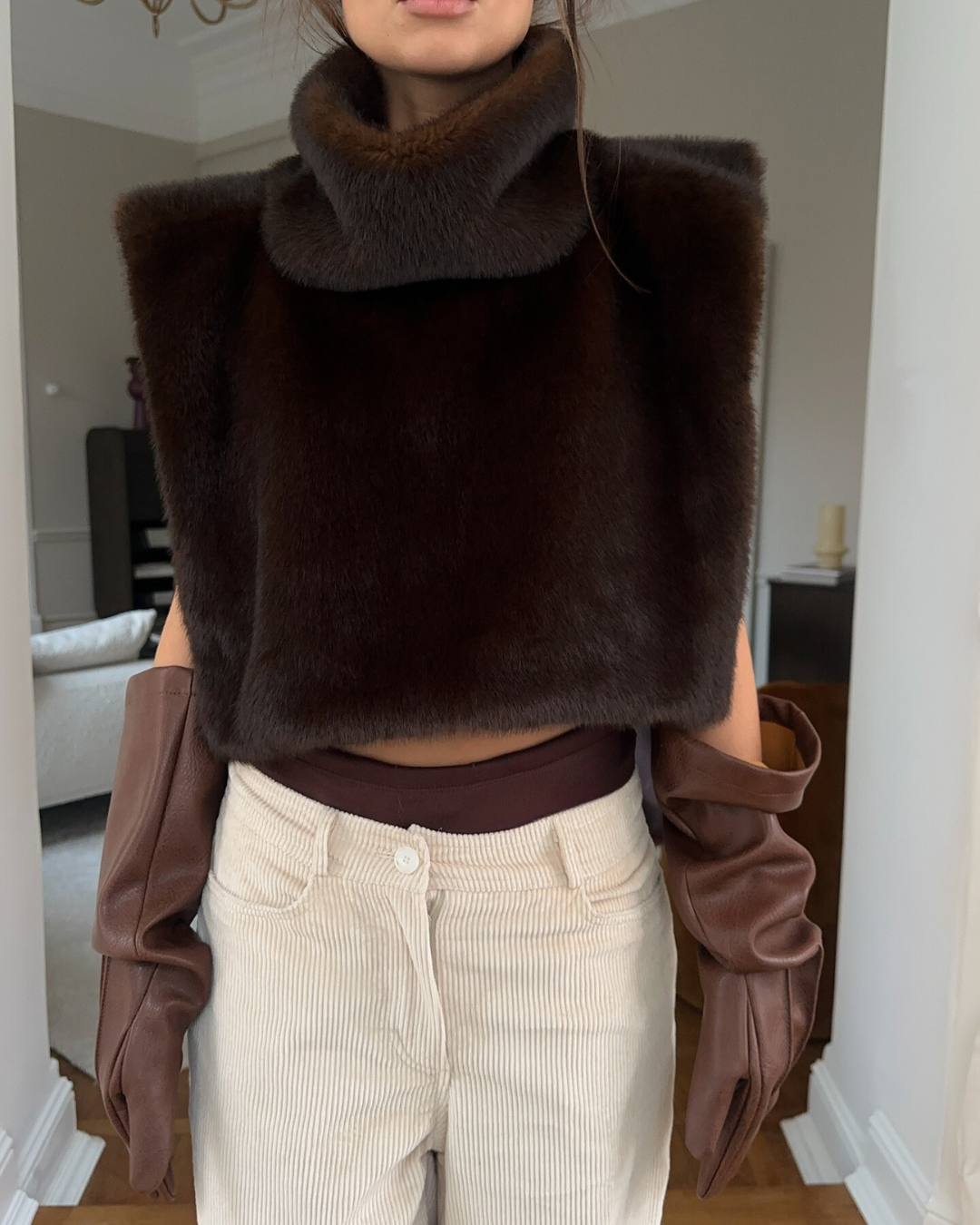 Women's plush faux fur turtleneck vest sleeveless silhouette with luxurious sculptural runway flair