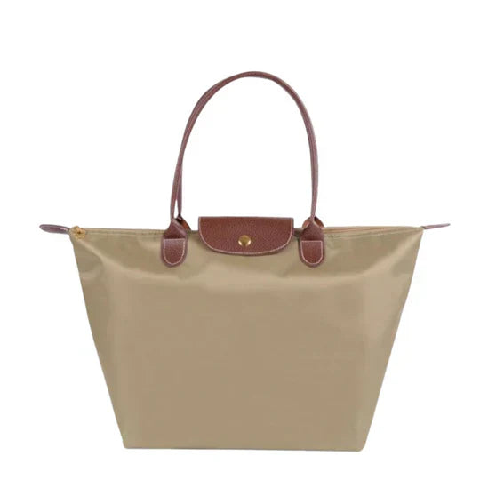 Structured black faux-leather luxury handle bag with clean silhouette for chic professionals