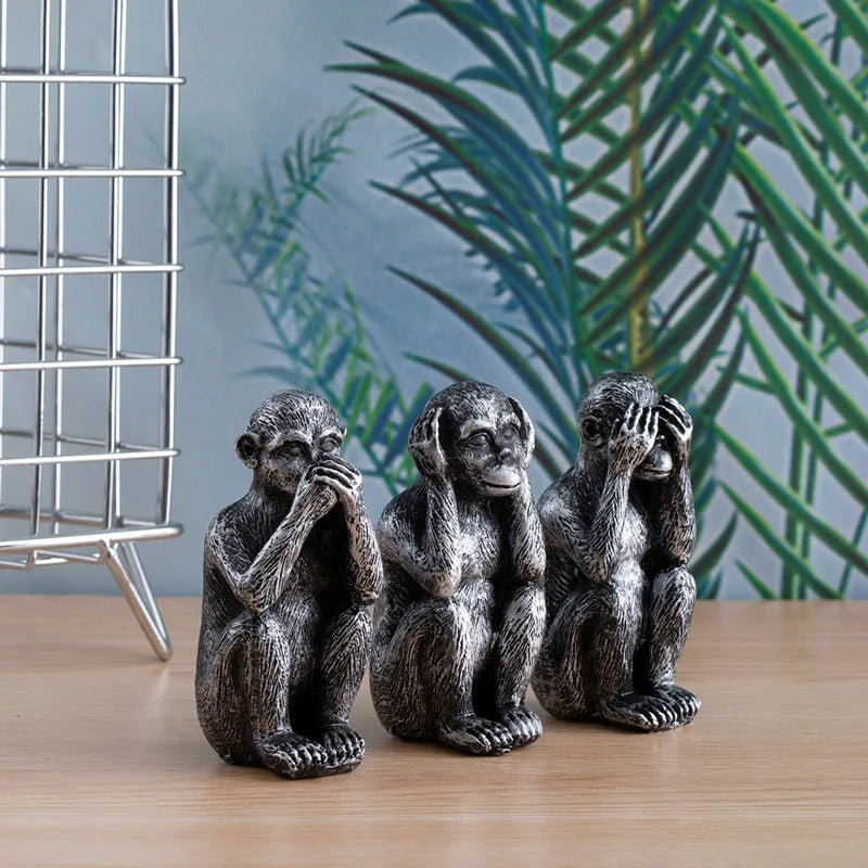 Handcrafted resin Three Wise Monkeys figurine trio in burnished gold or silver with intricate detailing