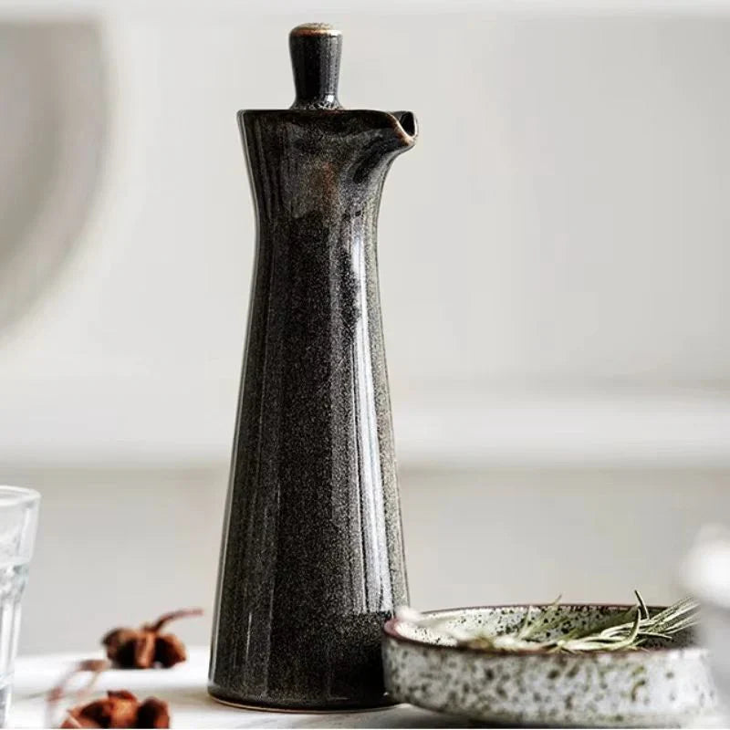 Glossy white ceramic oil dispenser with drip-free spout, sleek minimalist design for modern kitchens