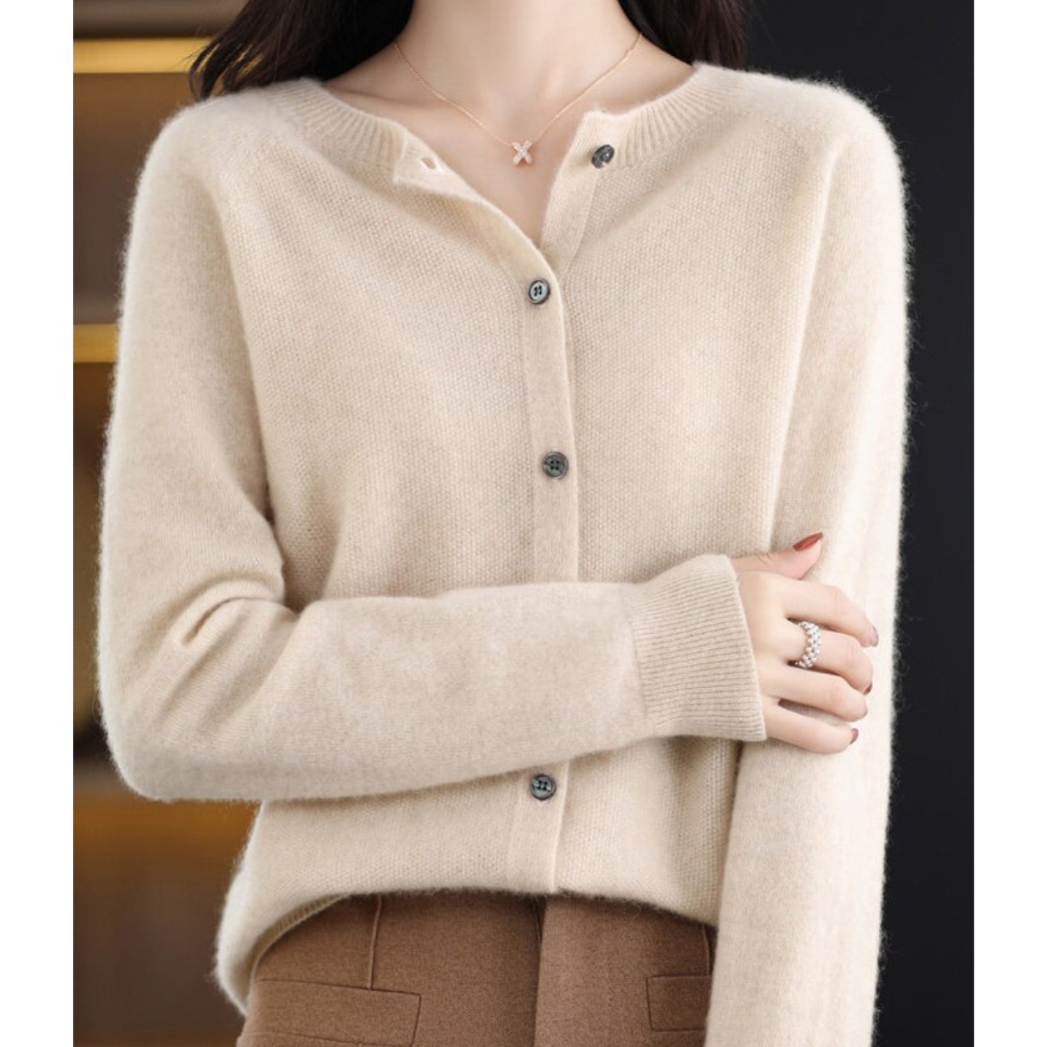 Women's merino wool cardigan round neck knit in neutral tone, soft luxurious slim-fit silhouette