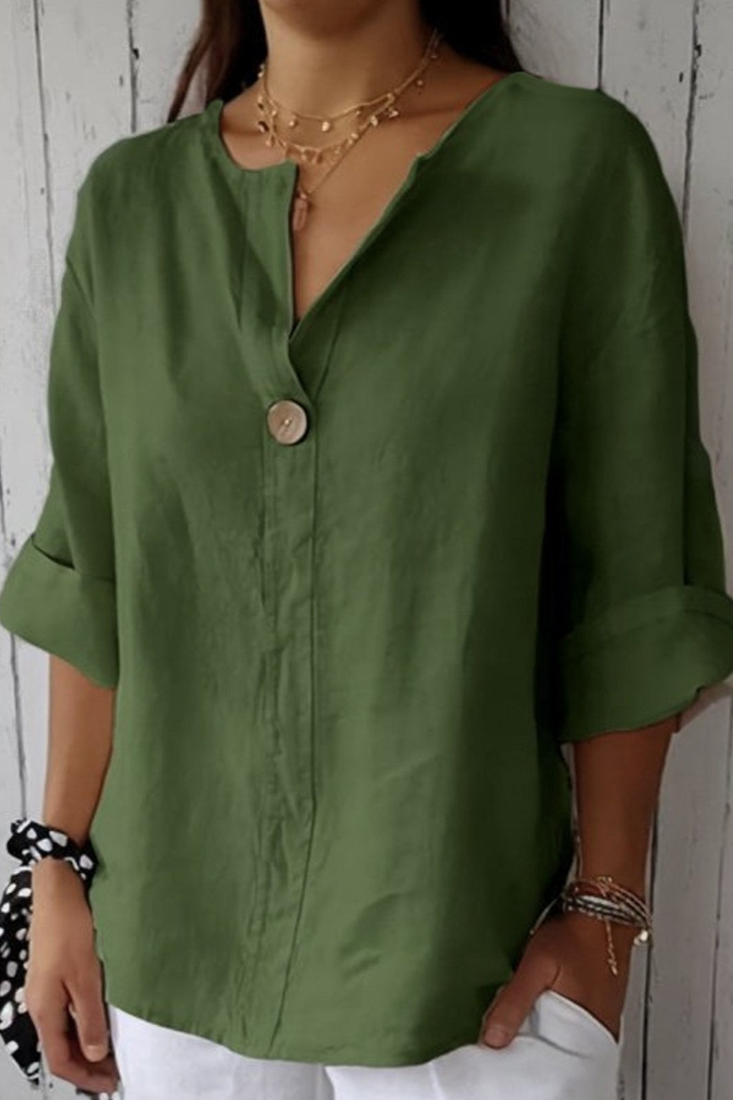 Women's relaxed blouse soft draped silhouette rolled short sleeves V-slit neckline button detail