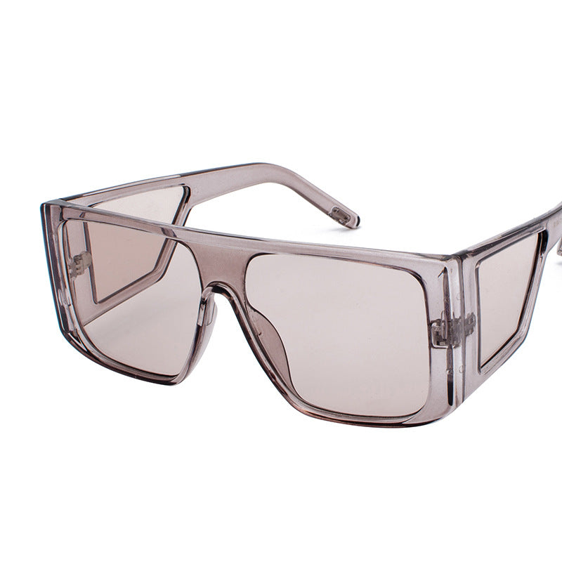 Oversized angular retro sunglasses with colored UV400 lenses, bold futuristic festival style