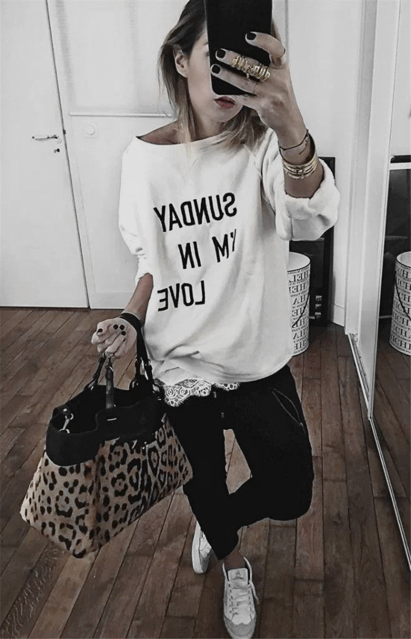 Women's oversized gray cotton sweatshirt with bold slogan print and long sleeves for casual comfort