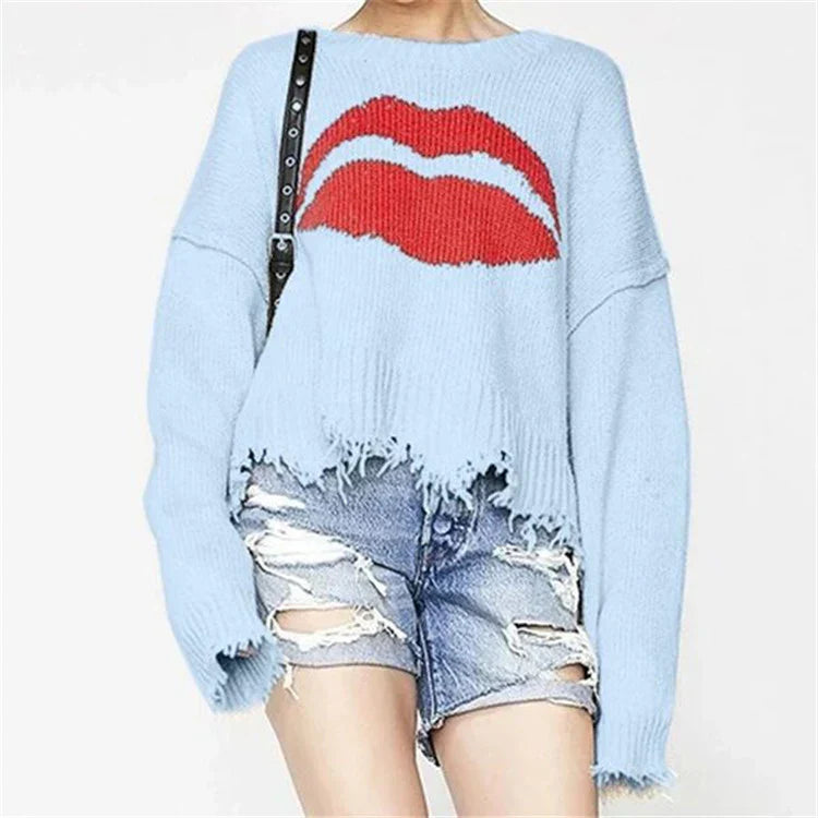 Women's chunky knit cropped sweater with lip motif and fringed hem, cozy oversized Nordic style