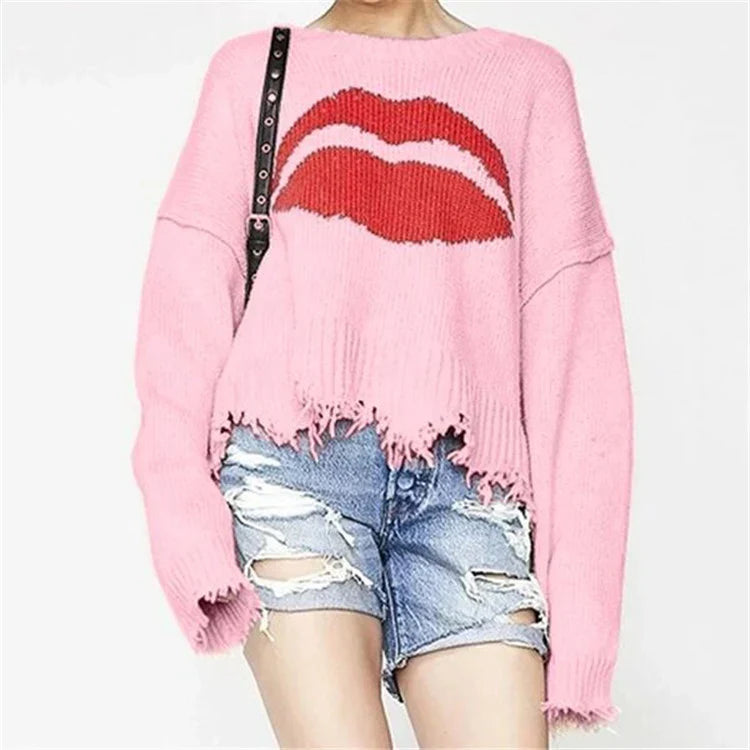 Oversized chunky knit short sweater with fringed edge and bold graphic print for women