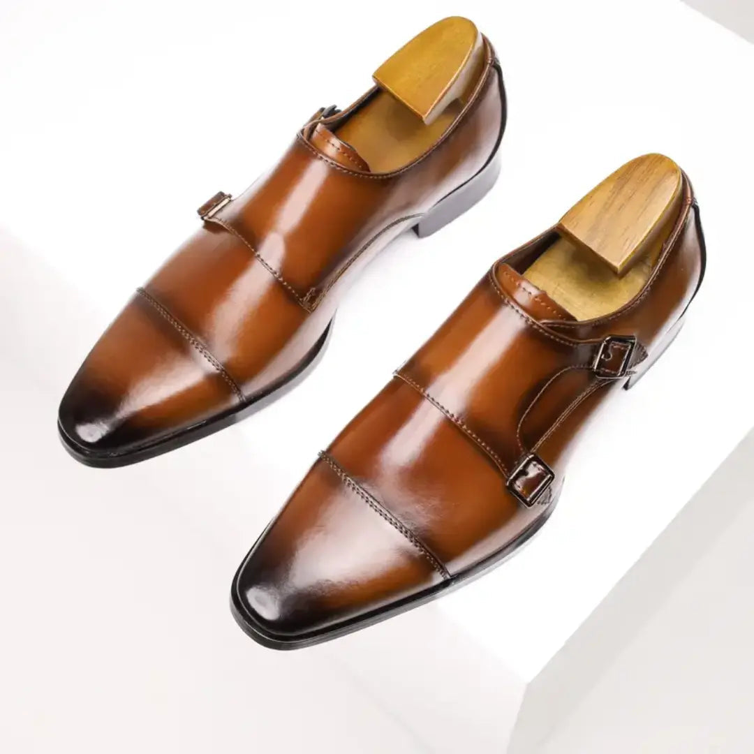 Men's black slip-on loafers with smooth leather-look upper and elegant stitched detailing