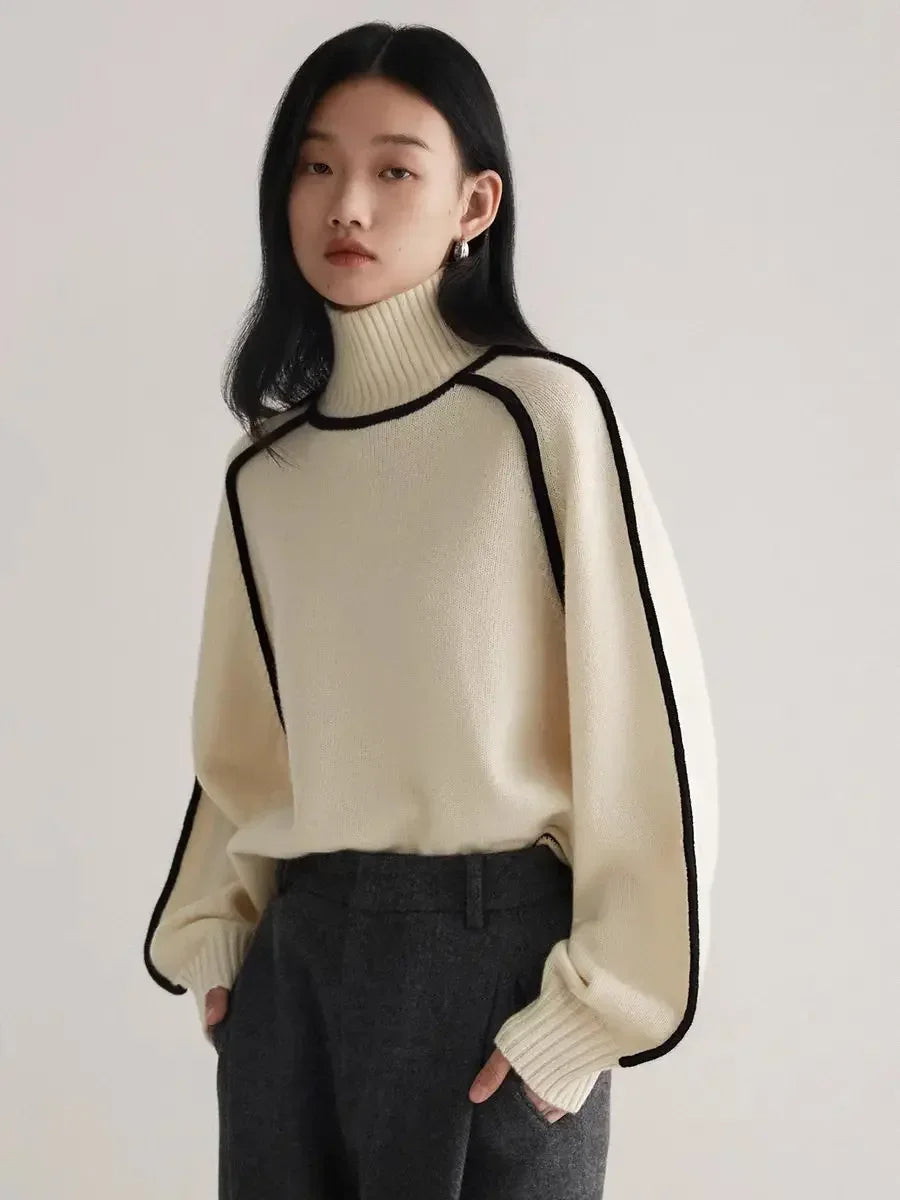 Women's contrast knit turtleneck sweater with bold seams, cozy warm fabric, versatile casual style