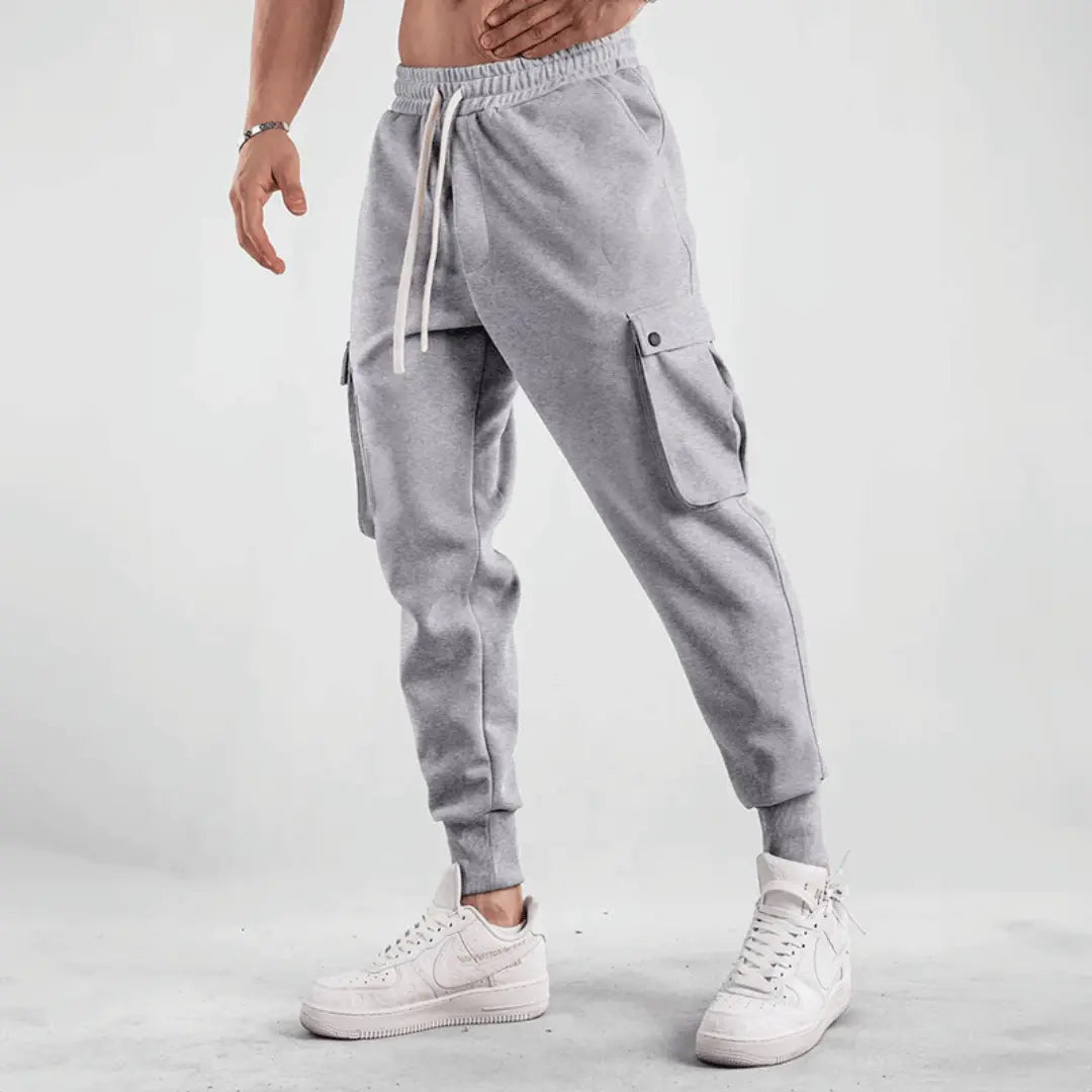 Black cargo joggers with adaptive breathable fabric, tapered street-style fit for urban runners