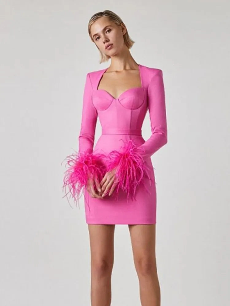 Beatrix black feathered bodycon mini dress with delicate feather accents for a luxurious silhouette