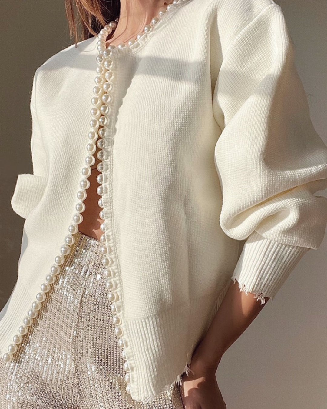 Women's soft knit cardigan with pearl trim detailing, elegant layering piece in classic style
