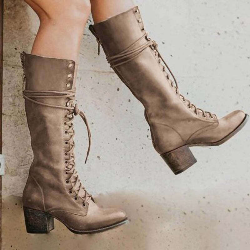 Women's vintage tall lace-up high heel boots with block heel and rustic detailing for bold style