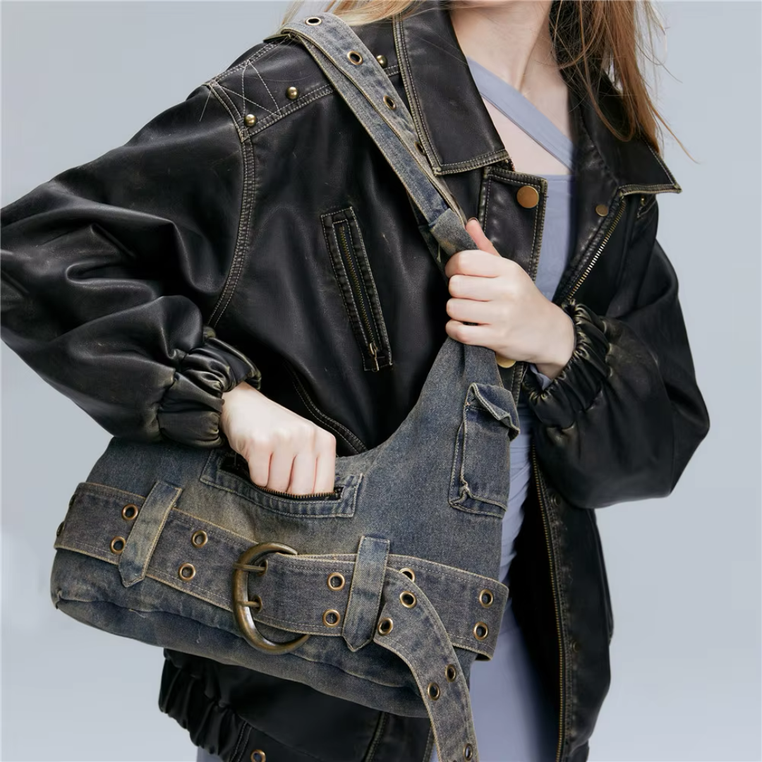 Ashen charcoal denim shoulder tote with intentional fraying, vintage rebel style, multiple pockets