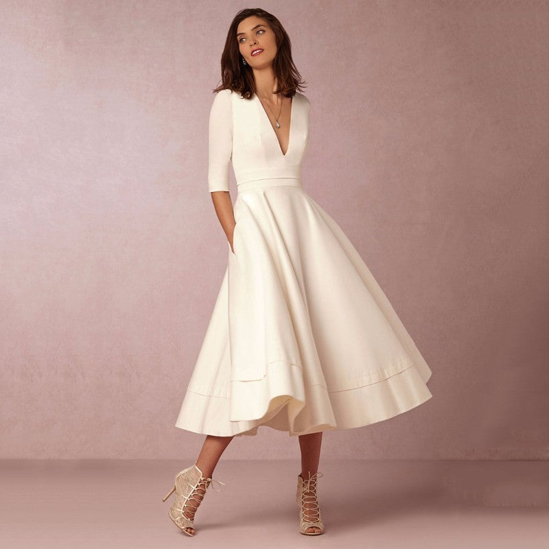 Retro 60s swing V-neck dress in vintage style with flattering flared silhouette and timeless chic fit