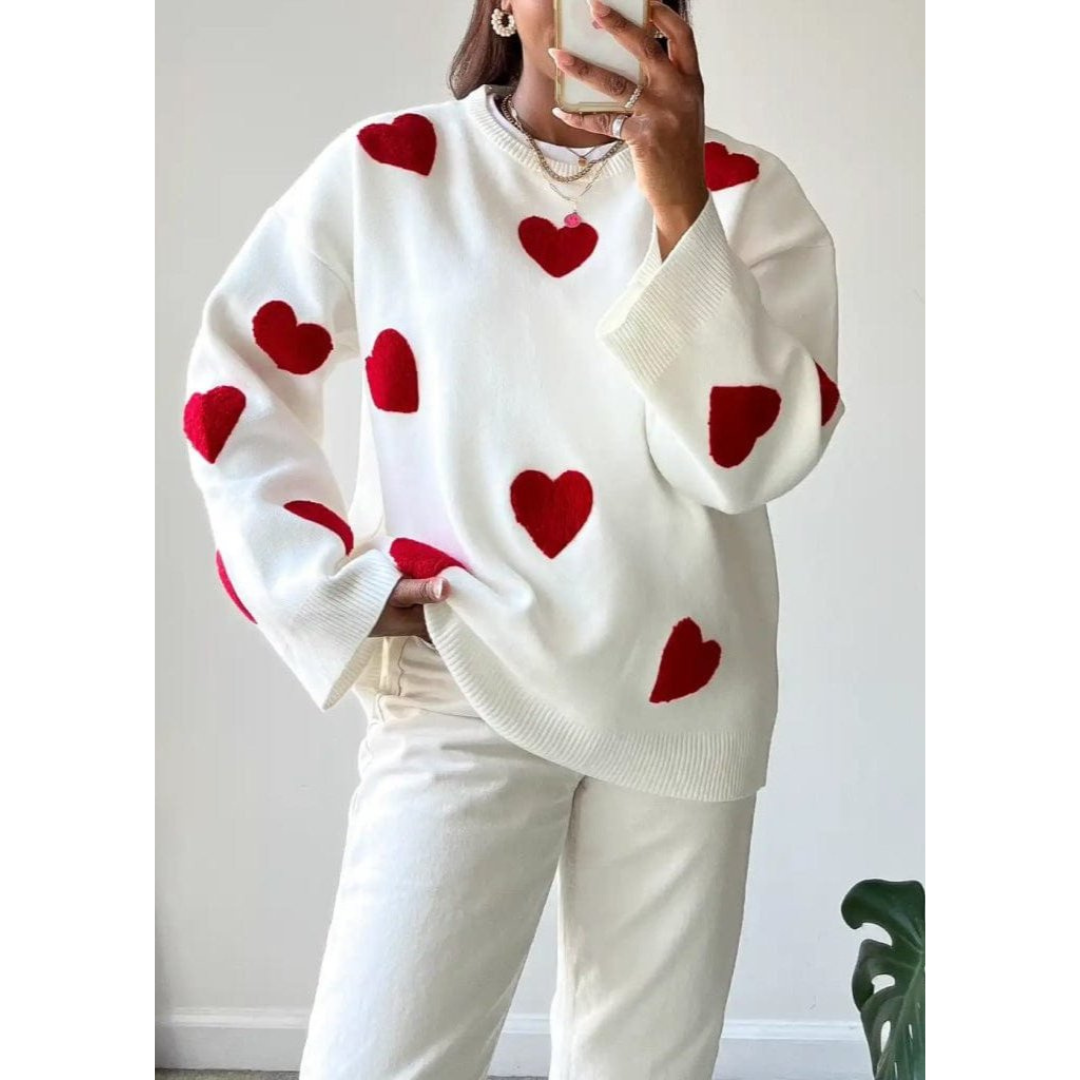 Women's cream knit sweater with allover heart pattern, relaxed cozy fit, classic romantic knitwear