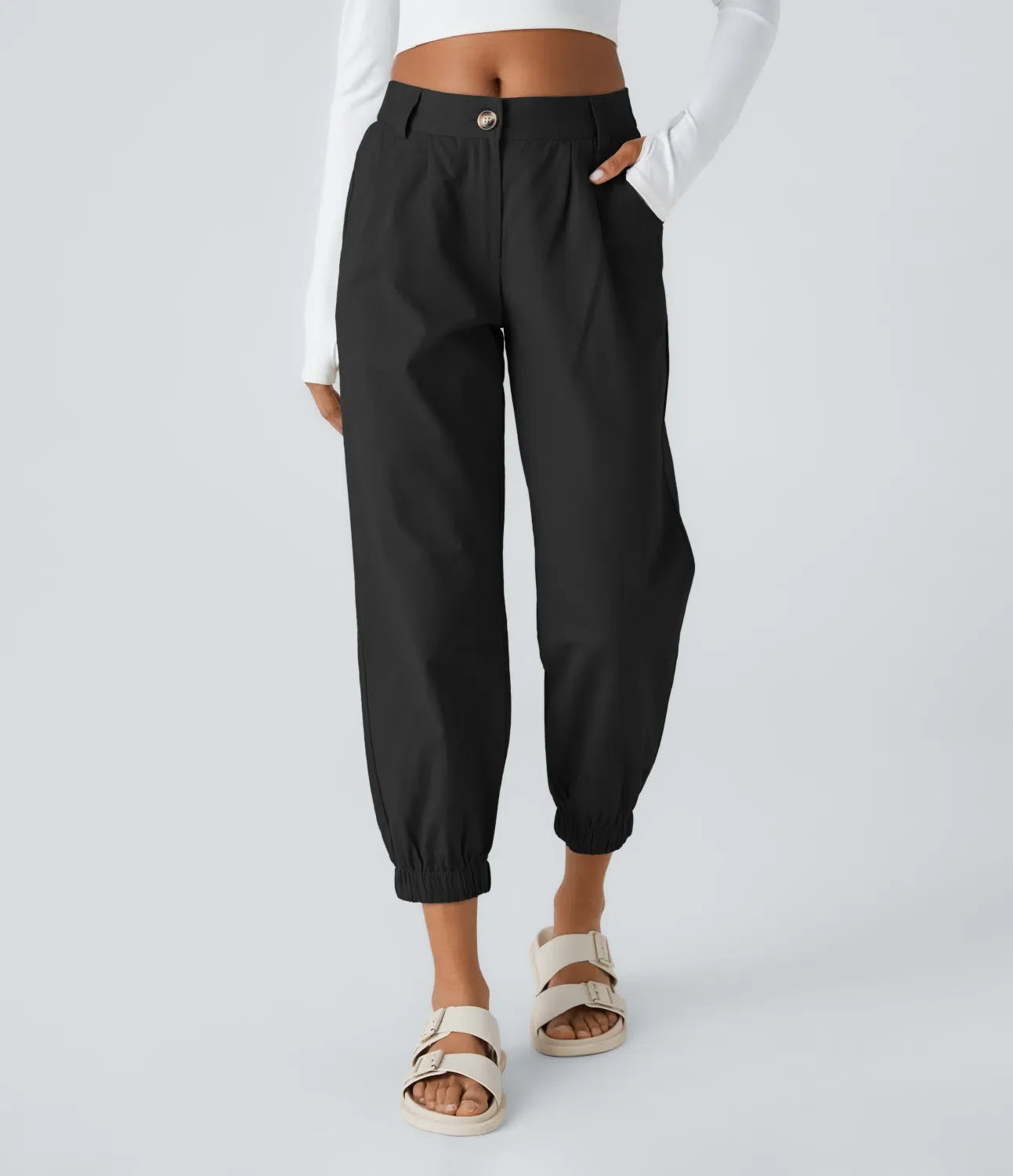 Men's tapered jogger pants with crisp pleats, cinched cuffs, high-rise fit in cotton-nylon blend
