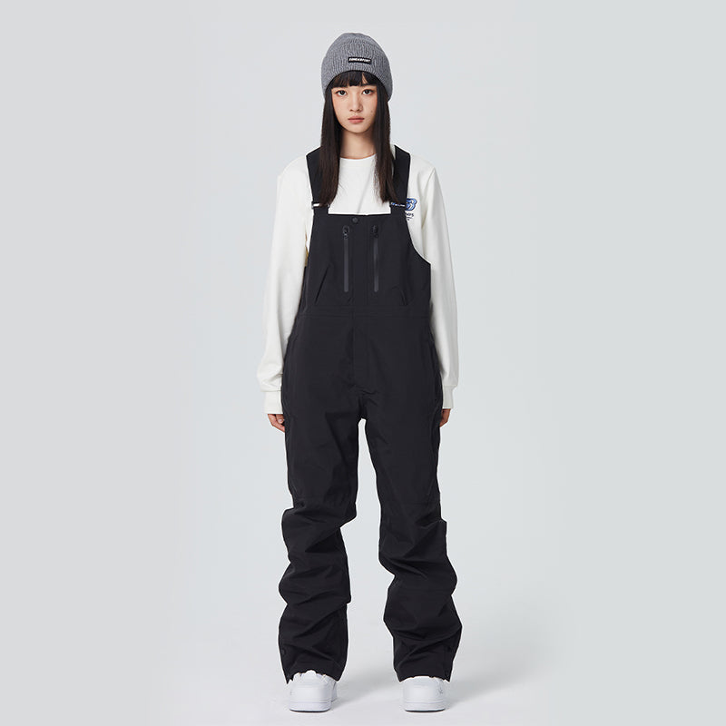 Women's black waterproof snow bib pants with adjustable suspenders and fully taped seams