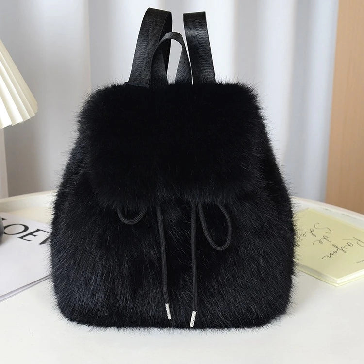 Women's faux fur backpack in plush high-density finish with drawstring closure and magnetic snap