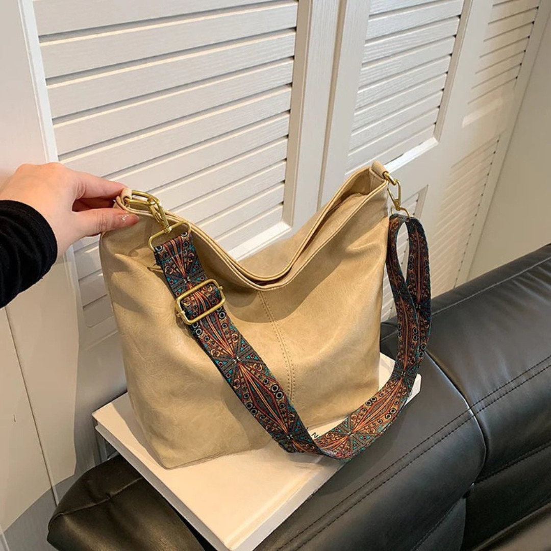 Women's everyday shoulder bag with wide adjustable strap, large interior pocket, versatile casual style