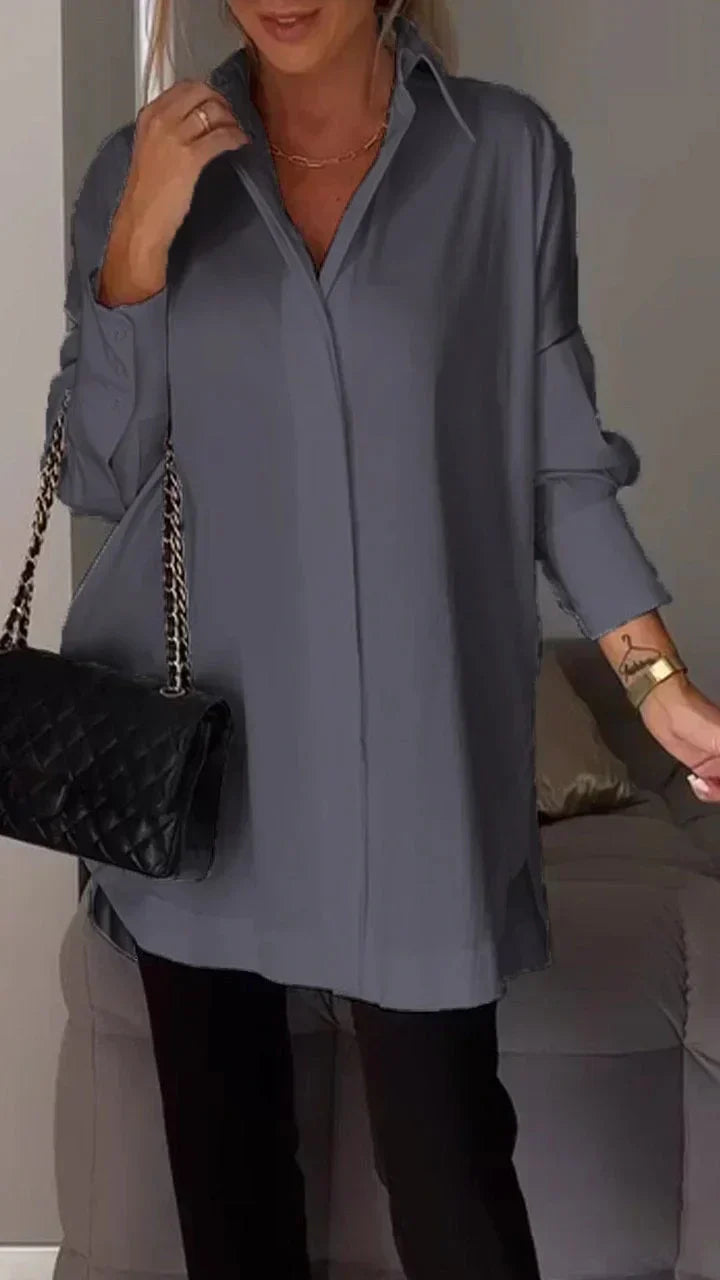 Women's white oversized blouse with rolled-up sleeves, relaxed silhouette, easy-care chic style