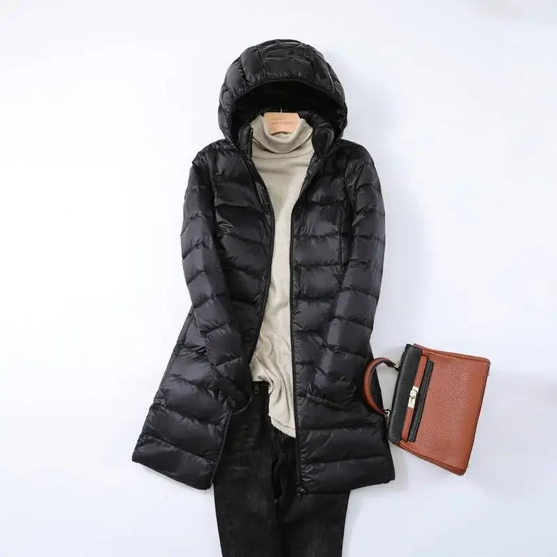Women's black packable puffer jacket with removable hood, slim fit for outdoor and city wear