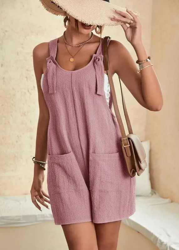 Women's soft cotton-blend lounge romper in neutral tone, relaxed fit with adjustable bow straps and pockets