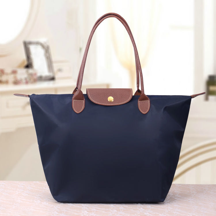 Large structured women's tote bag elegant designer shoulder bag spacious everyday carry durable