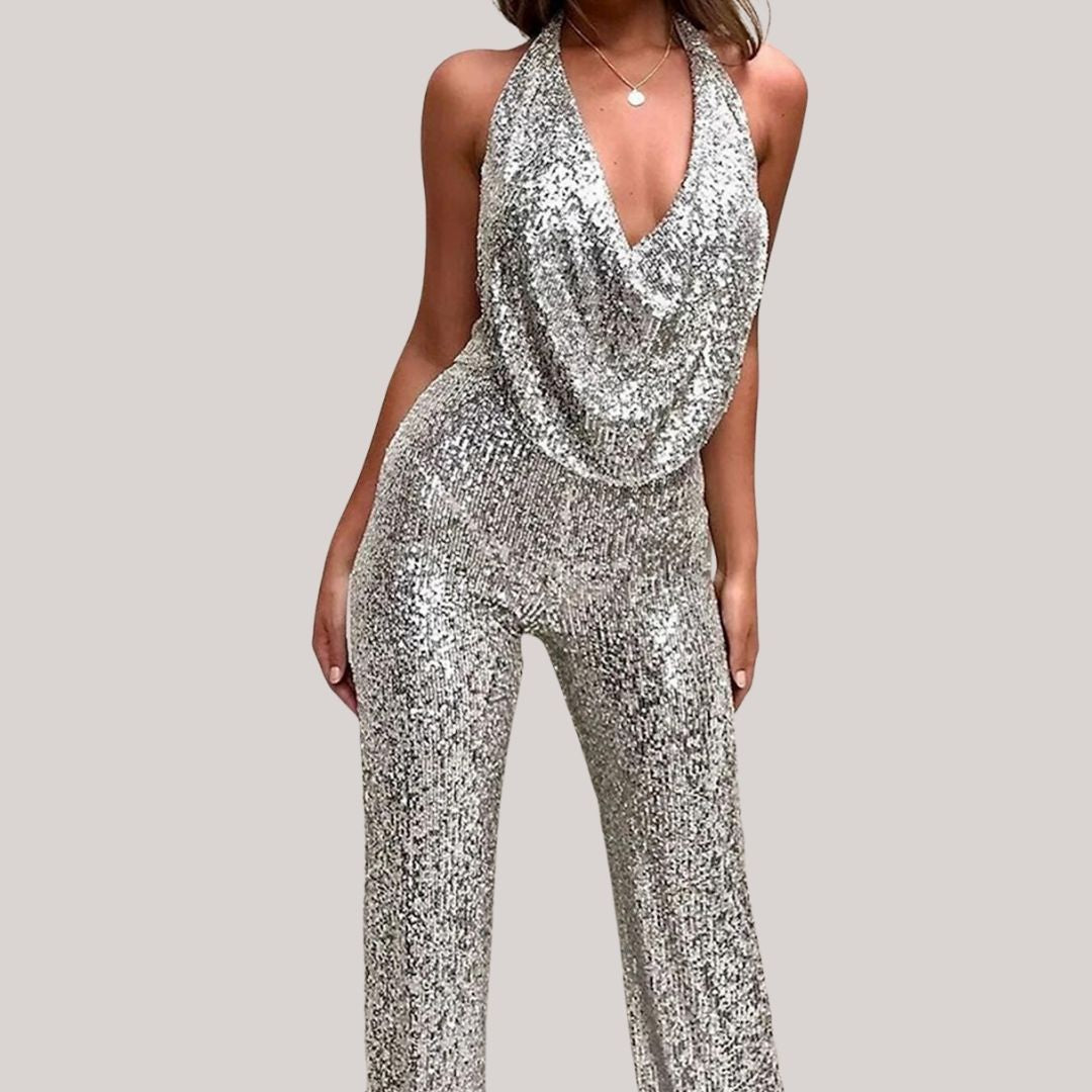 Women's silver sequin halter jumpsuit with deep-V neckline, flowing silhouette, all-over shimmer
