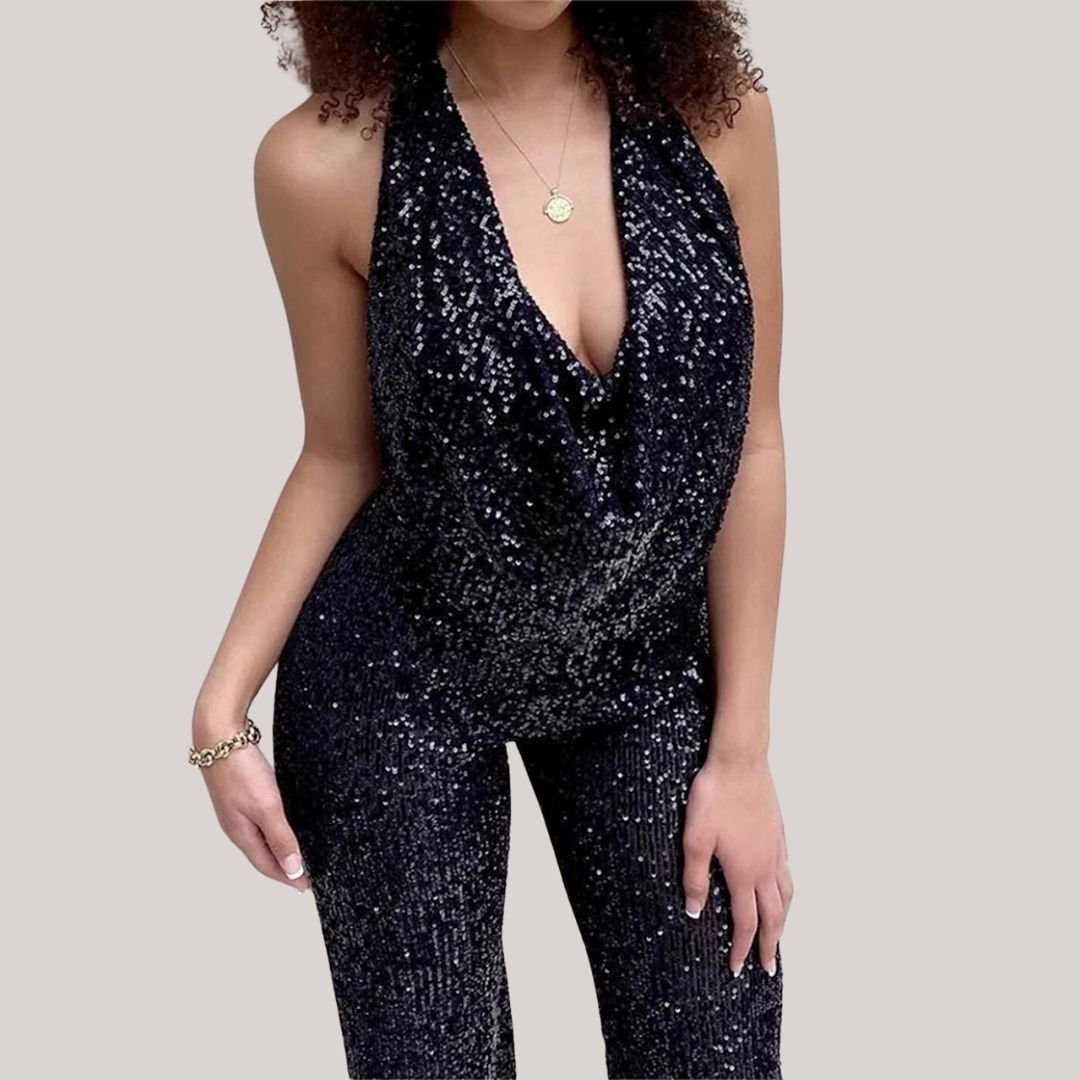 Women's silver sequin halter jumpsuit with deep-V neckline, flowing silhouette, all-over shimmer