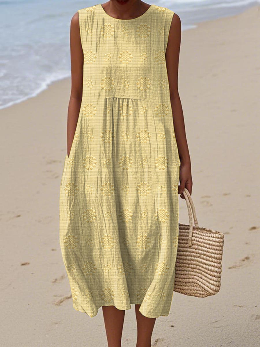 Women's sleeveless textured midi dress with gathered waist, circular print motifs, lightweight breezy beach style