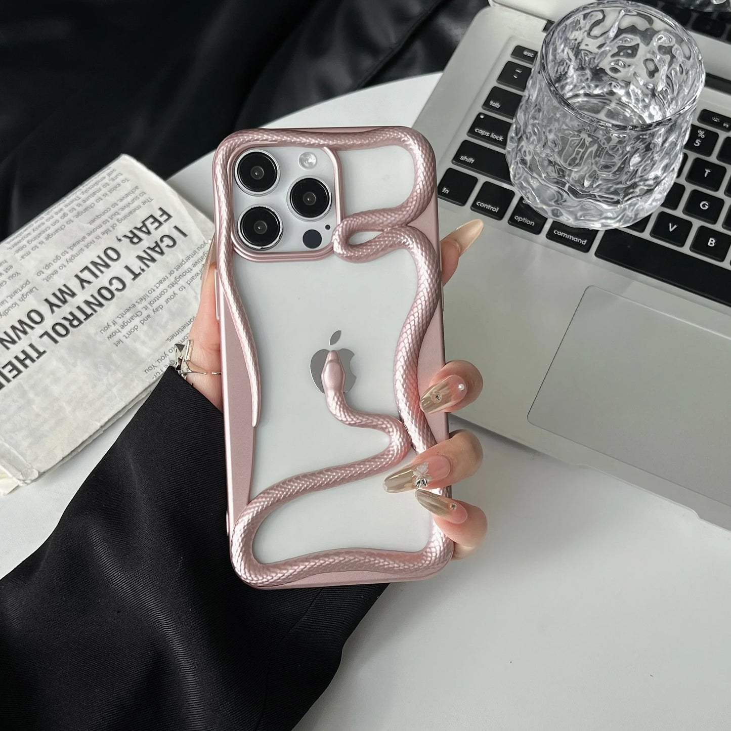 Black iPhone case featuring 3D coiled serpent around Apple logo, garden-inspired bold protective design