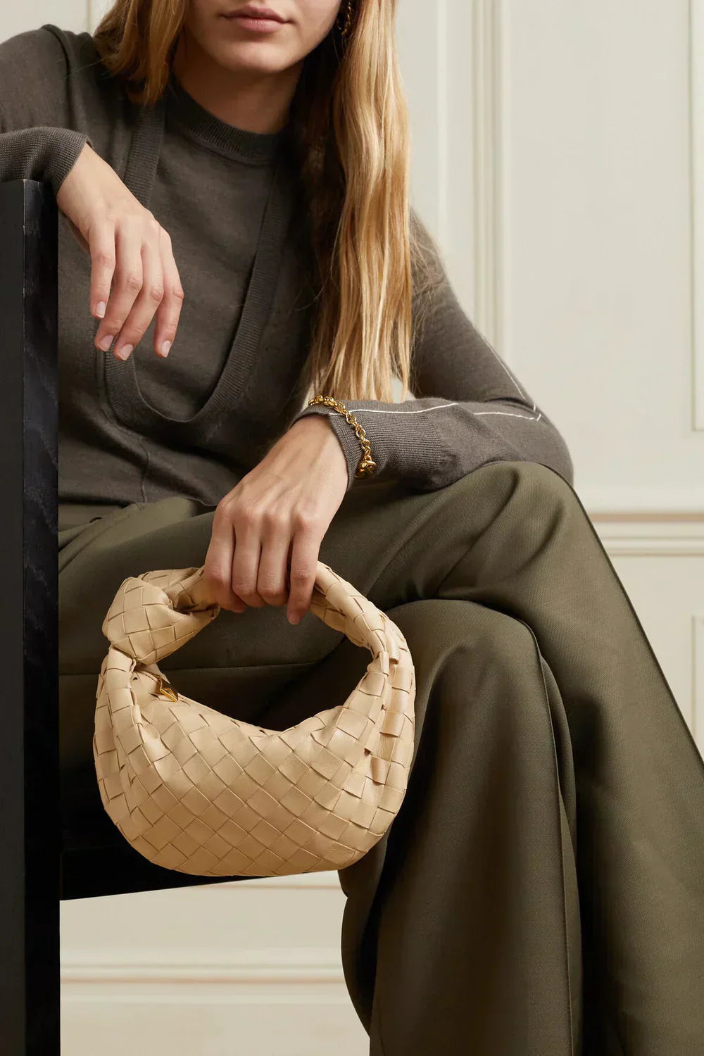 Women's woven shoulder bag with knotted handle, spacious interior, chic everyday versatile design