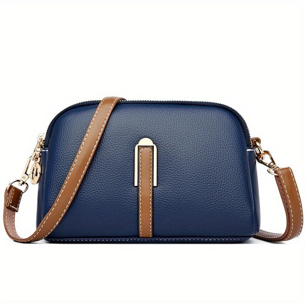 Elaine black vegan leather crossbody bag with gold-tone zipper adjustable strap compact chic