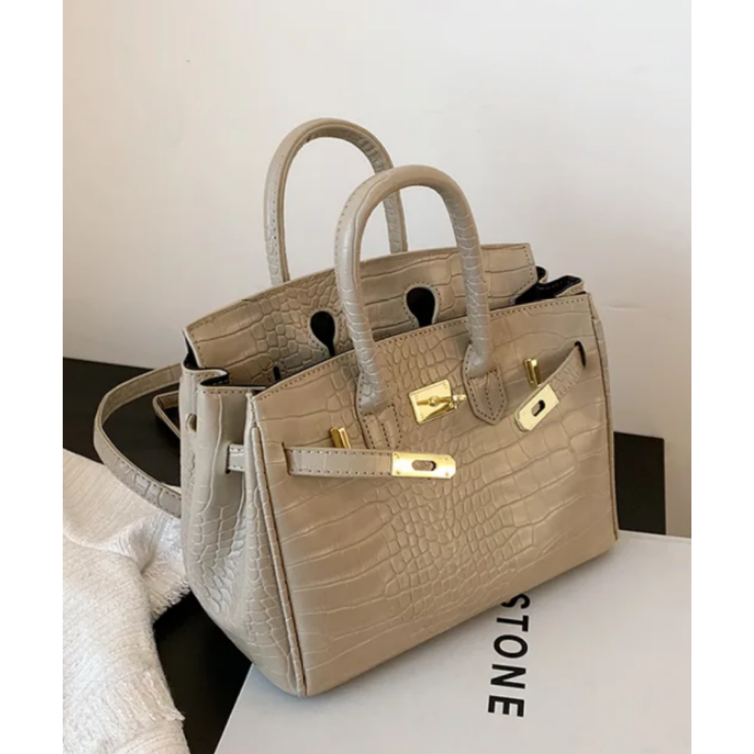 Large women's designer crossbody handbag, elegant structured silhouette with adjustable strap and ample storage